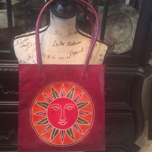 Beautiful Wine Handbag with A Sun Appliqué
